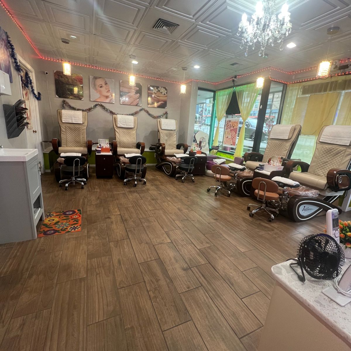Pedicure lounge inside SD Nails & Spa in Broadview, Seattle, with cream massage chairs and warm lighting